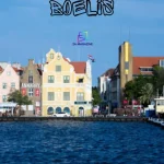 Willemstad Curaçao waterfront with colorful colonial buildings and fishing boats at dawn