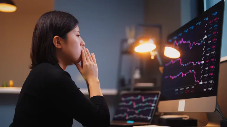 investor analyzing stock charts before using 5starsstocks.com buy now feature