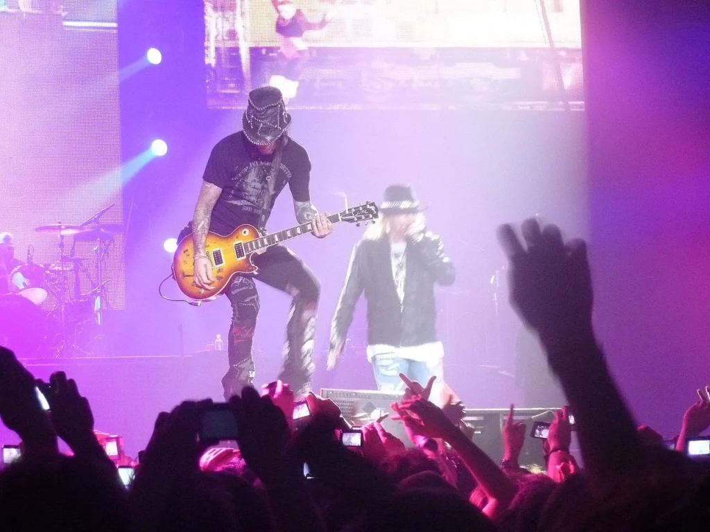 DJ Ashba playing Gibson Les Paul guitar on stage with Guns N' Roses