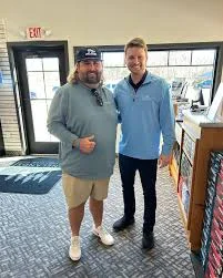 Fat Perez Nick Stubbe and Robby Berger standing together in golf pro shop