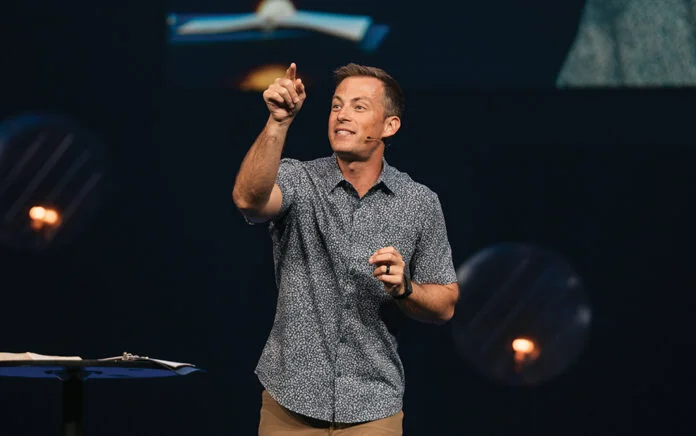 Josh Howerton preaching on stage at Lakepointe Church