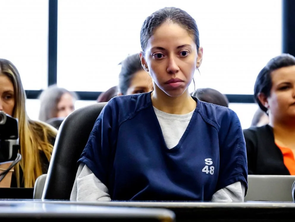 Dalia Dippolito sitting in a courtroom wearing a blue prison uniform during her trial proceedings.