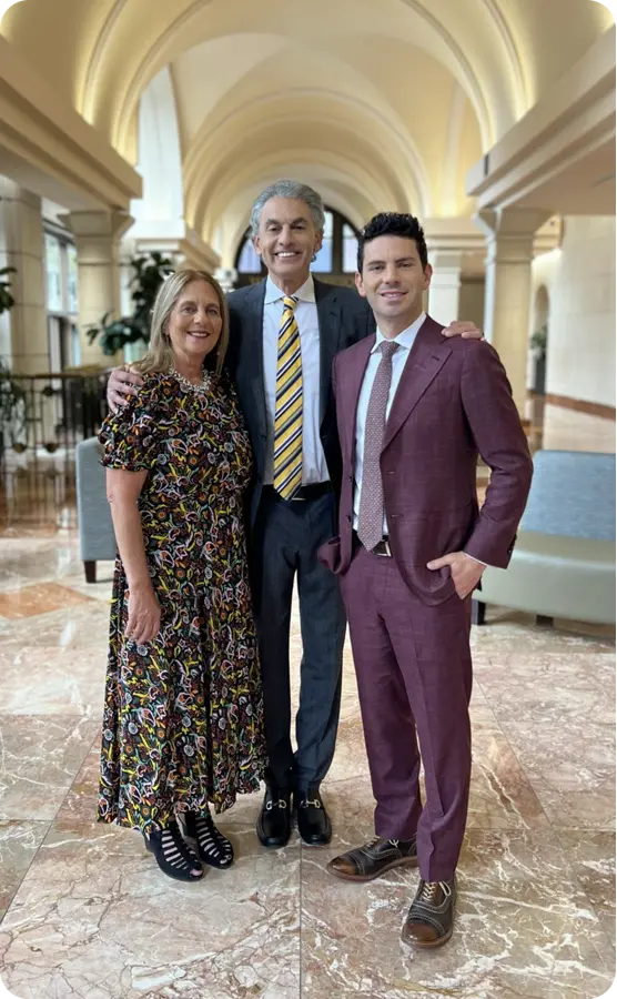 David Gruber standing with his wife Nancy Gruber and son Steven Gruber.
