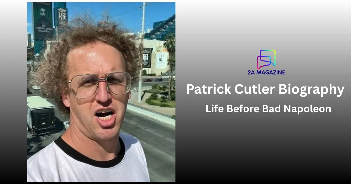 Patrick Cutler as Bad Napoleon in curly wig and aviator glasses